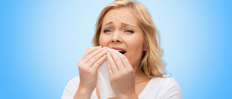 unhappy-woman-with-napkin-sneezing