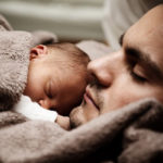 father soothes baby with colic