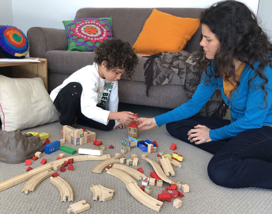 Ana Carolina using Play therapy on a patient