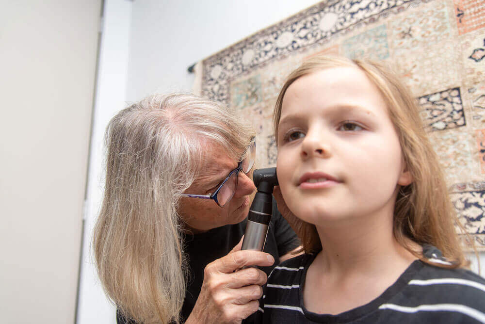 Linlee examining ear